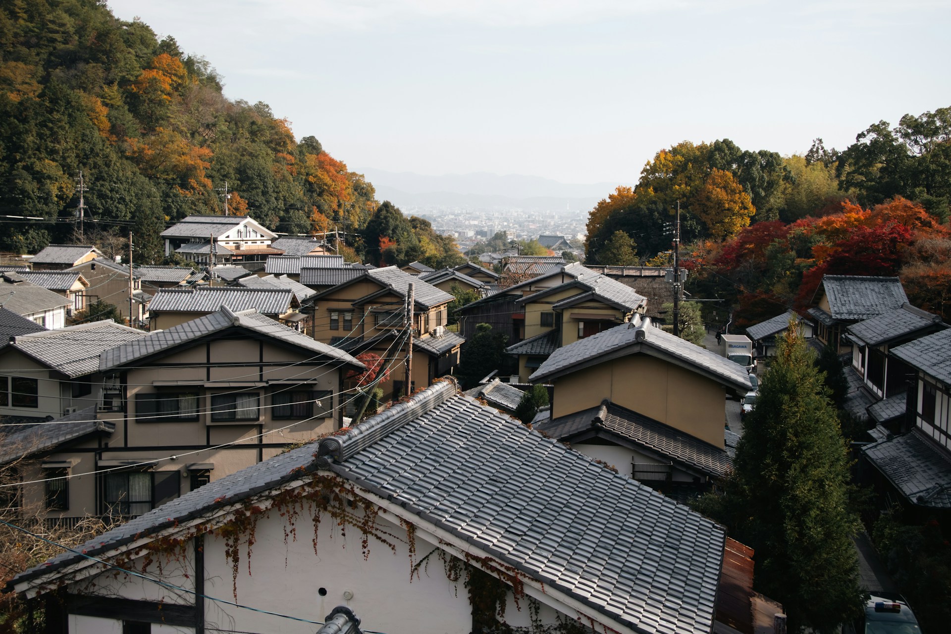 Traditional Japanese houses on a hillside in autumn